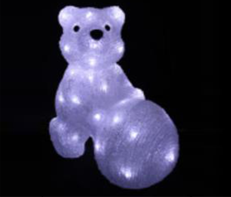 The bear pushes the snow ball